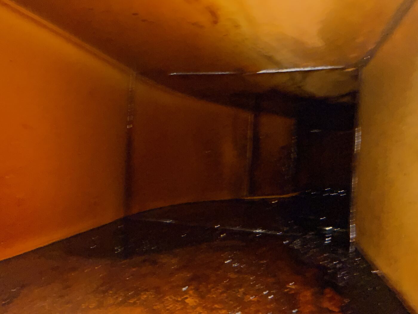 Duct run with heavy grease buildup, deeper section