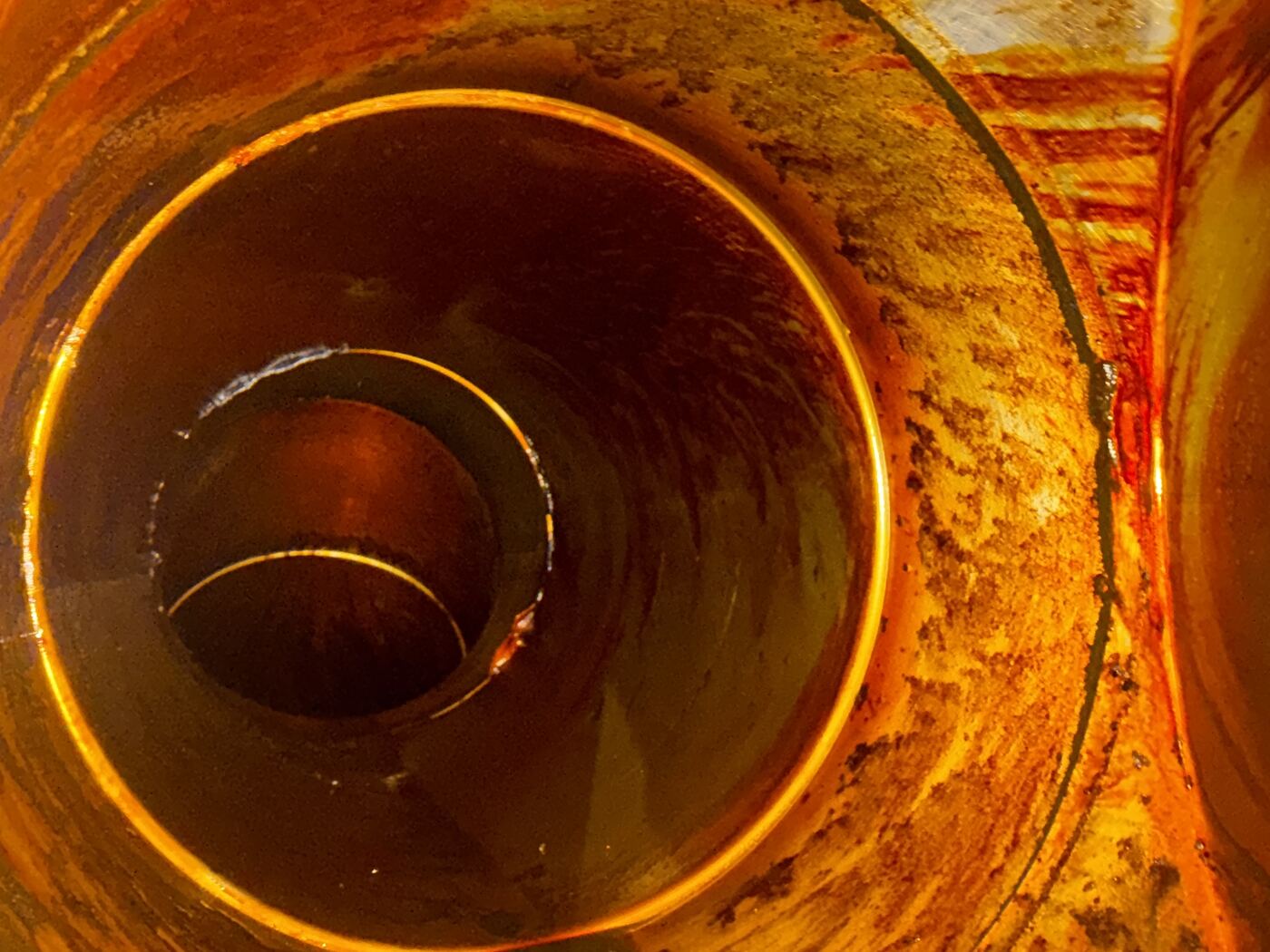 Rusted grease-caked duct interior before cleaning