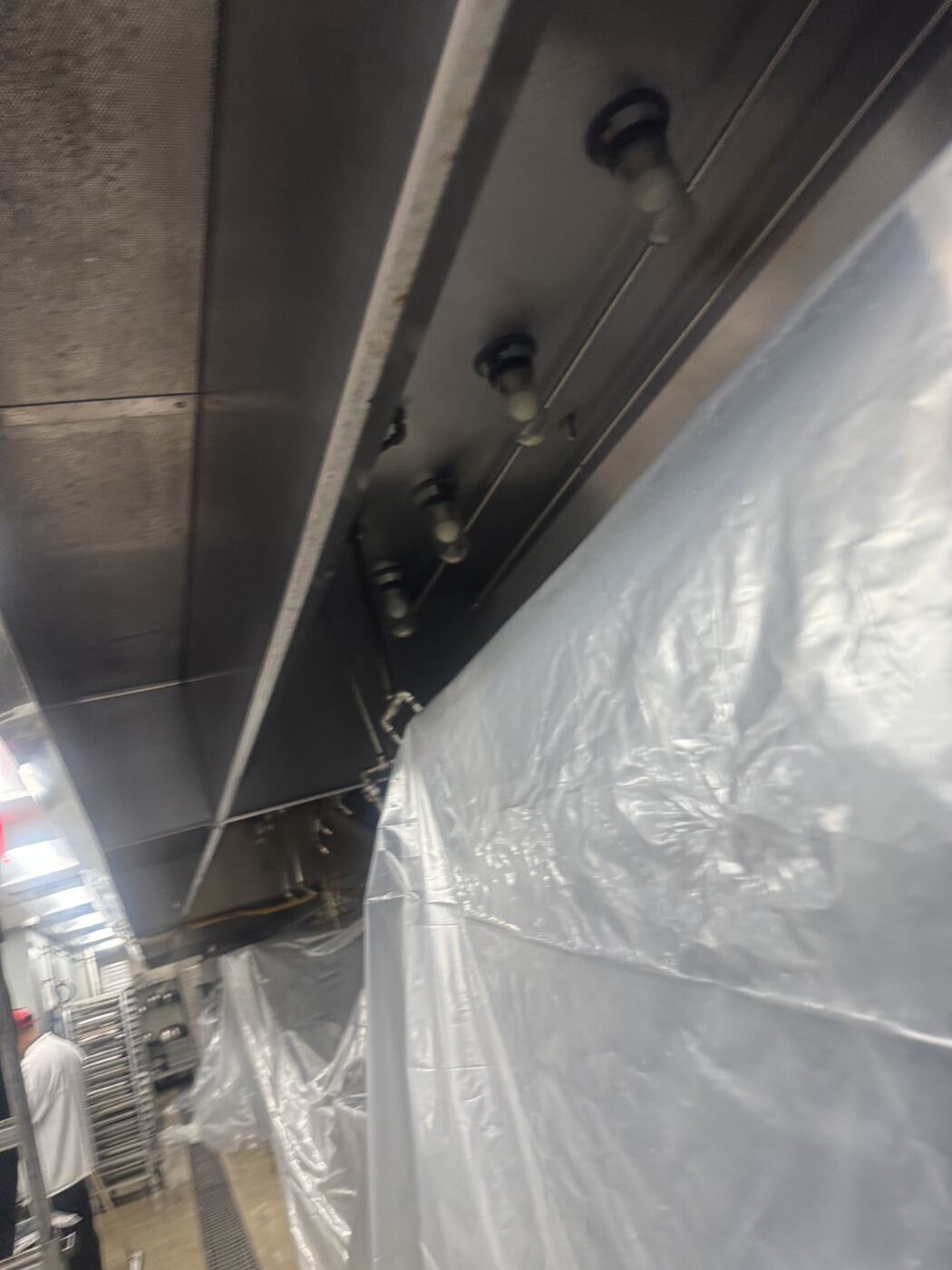 Technicians on site with hood protected during service